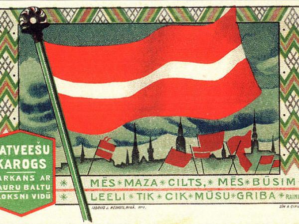 J.Rieksta 1918.g. izdotā pastkarte ar Latvijas karogu pēc A.Cīruļa meta.